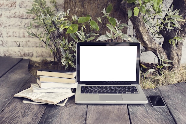 An image depicting a laptop displaying a website or document with book reviews. On the screen, there are different reviews with star ratings and short excerpts. The background is blurred to keep the focus on the laptop screen, highlighting the digital aspect of finding and reading book reviews online.