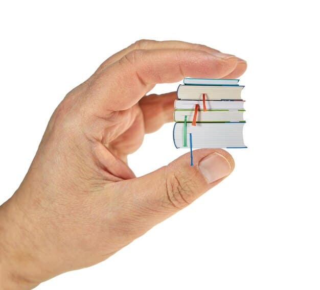 A hand holding a piece of paper with titles of different books. The paper is marked with checkmarks next to some titles, suggesting a voting process for selecting the next book club read.
