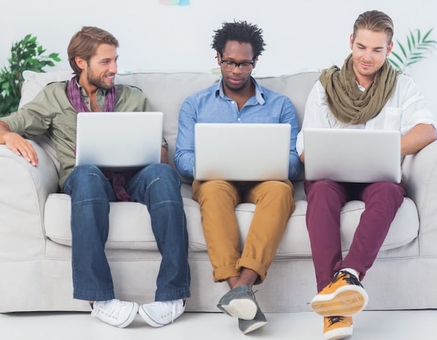 Three people sitting at their desks at home, all with laptops open. They are attending a virtual book club meeting. One woman is holding a copy of the book being discussed, another is taking notes, and the third is actively speaking. The background suggests a comfortable and inviting home environment for each participant.