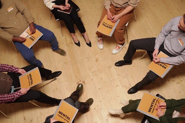 An overhead shot of hands from diverse backgrounds holding books together in a circle. The books are a mix of genres and sizes, and the hands are positioned in a way that symbolizes unity and shared love for reading.