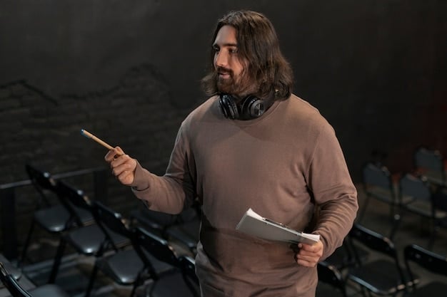 An author on stage speaking to a crowd in a large auditorium. The stage is well-lit, and the audience is attentively listening. The scene captures the scale of a large-scale author event.