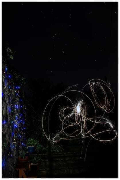 A single, delicate thread of light cascading through a dark, abstract space, suggesting unseen connections and the beauty of subtle artistry, evoking poetic themes.