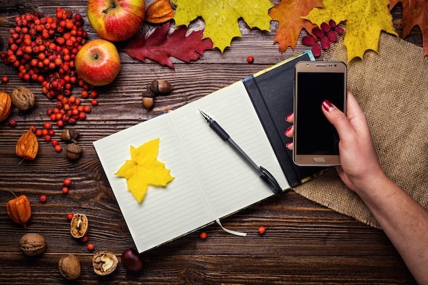 A person's hand meticulously writing notes in a beautifully bound notebook, surrounded by several open books and a cup of tea, emphasizing the thoughtful and detailed process of crafting a thorough and compelling book review.