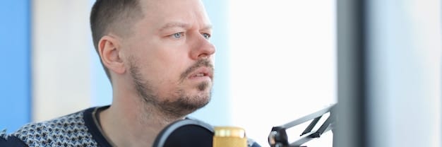 A close-up of a professional voice actor in a soundproof booth, wearing high-quality headphones and speaking into a condenser microphone, demonstrating concentration and vocal control.