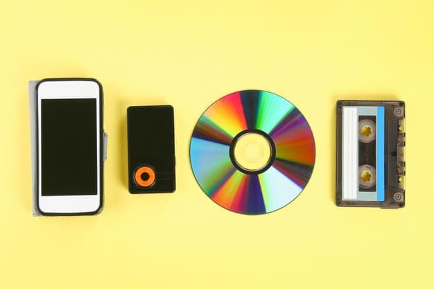 A stack of audio CDs and vinyl records next to a modern smartphone playing an audiobook, symbolizing the evolution of audio formats and different genres.