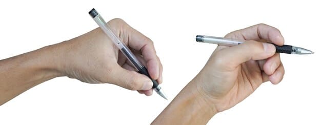 A close-up of two hands, one holding a pen and the other scrolling on a tablet, both positioned over a neatly organized desk. The desk features an open notebook with handwritten notes, a laptop displaying a collaborative document, and a cup of coffee. The setting is clean and well-lit, conveying productivity and synergy. The hands are interacting subtly with the documents, suggesting a shared creative process.