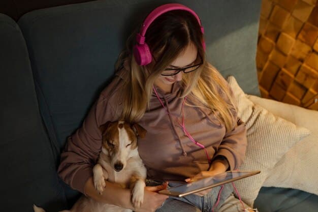 A blind person listening to an audiobook on headphones, smiling gently, with a guide dog resting beside them in a calm, sunlit room, emphasizing accessibility.