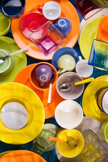 A communal dining table filled with small, artfully arranged dishes, each clearly inspired by a different literary theme, showcasing a variety of textures and colors.