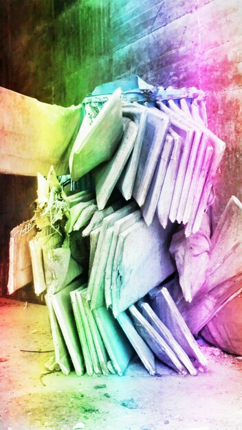 A stack of diverse, brightly colored debut novels with varying cover art, some open to show intriguing text, suggesting new beginnings and untold stories.