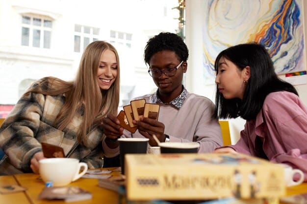 A group of diverse people laughing and interacting during a book club meeting, with one person holding a Bingo card and a pen, emphasizing the social and engaging aspect of the game.
