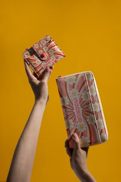 A close-up shot of a hand holding a book with diverse cultural patterns and designs on the cover. The background is blurred, focusing attention on the book and the hand. The image emphasizes the importance of diverse voices in literature, a key aspect of The 2025 Book Club Reading Challenge.